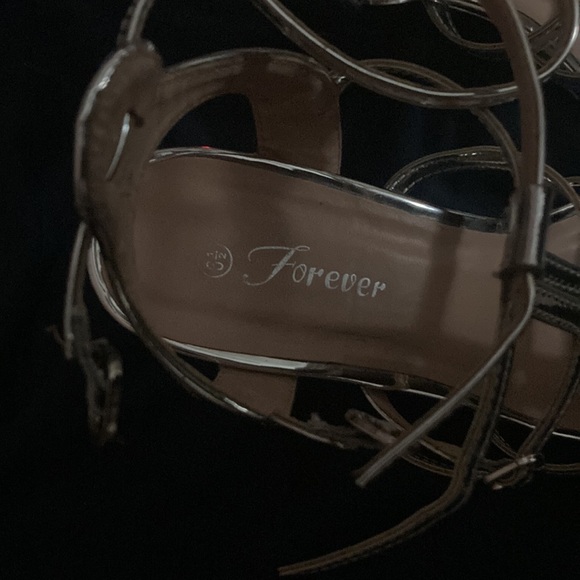 Forever size 6 1/2 silver or chrome more or less. - Picture 3 of 3